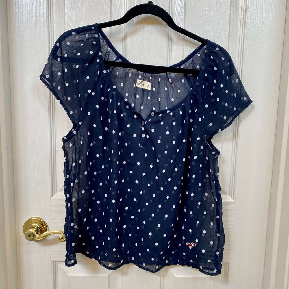 Hollister sheer top. Size: L. Navy blue & white polka dot.